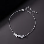 Cargar imagen en el visor de la galería, Tobillera Corazón Alas de Ángel con Circones Blancos. Acero Titanio Chapado Oro 18K